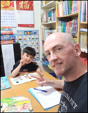 A primary student reading an Oxford Reading Tree book.